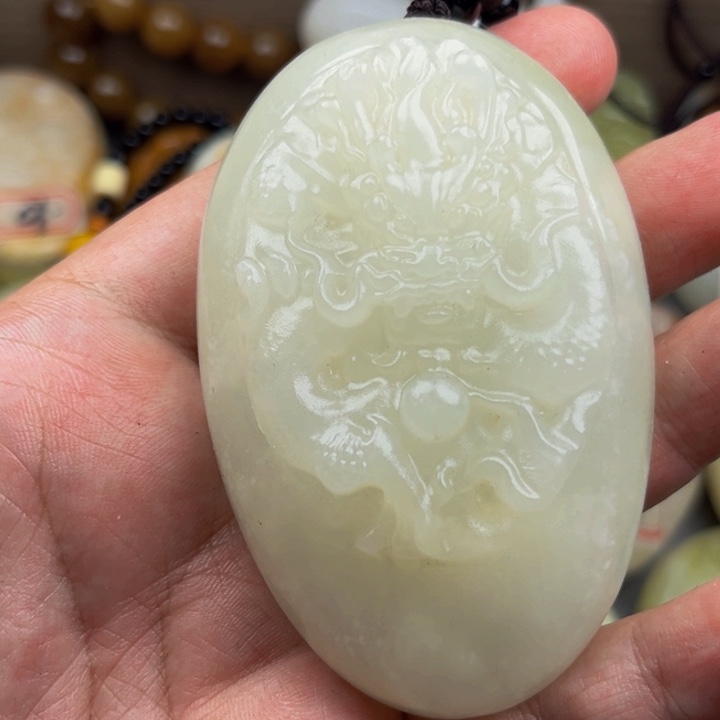 拜***拜石材方解石手把件龙