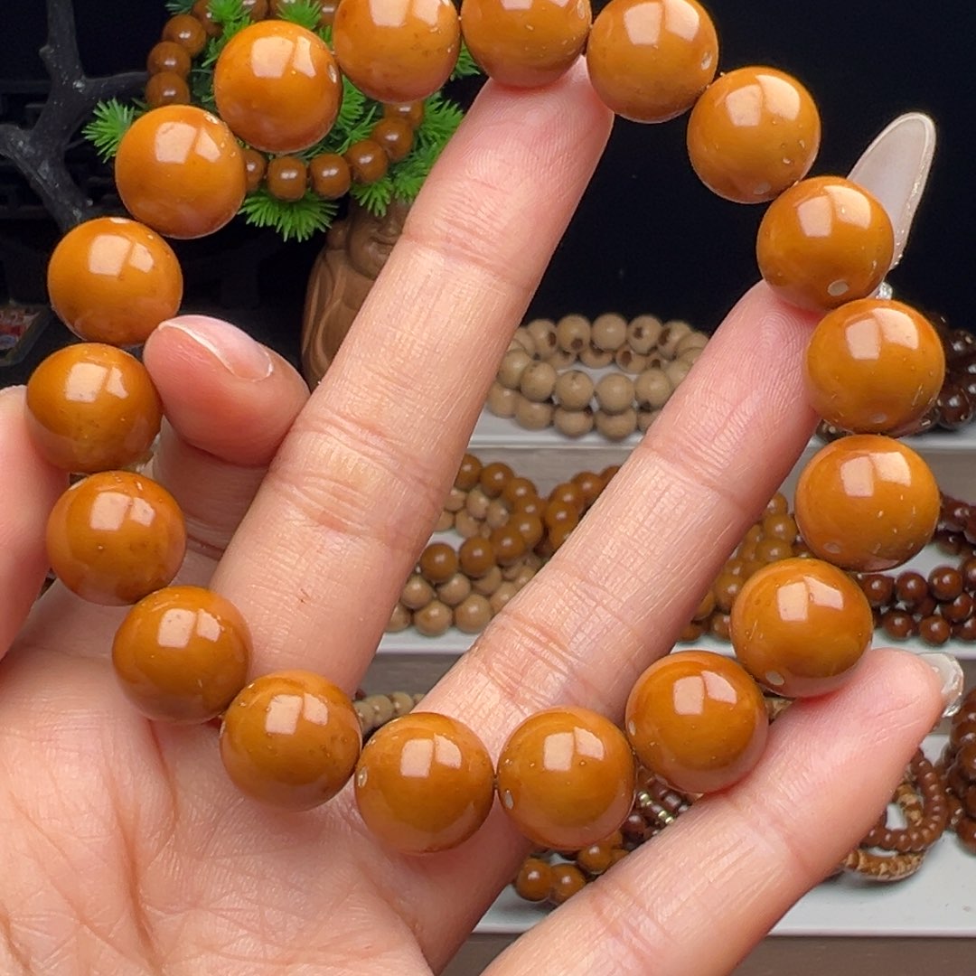 潇***洒手串紫金鼠卡12.3半实心黄皮光珠