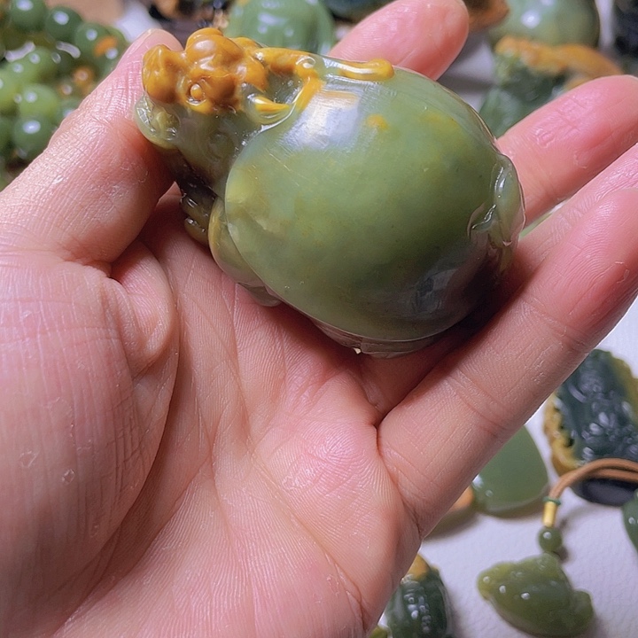 和田玉手把件未镶嵌丹**券