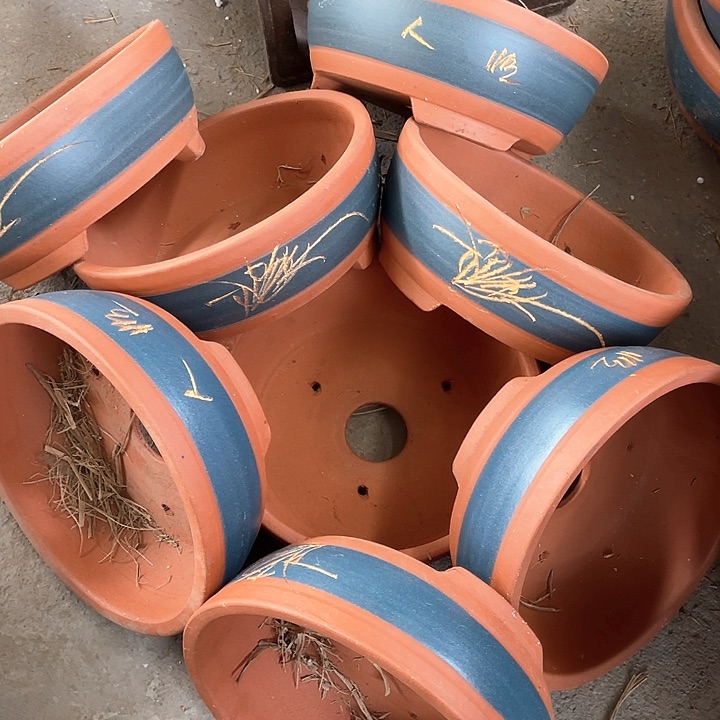 紫砂花盆100-8。  22-9