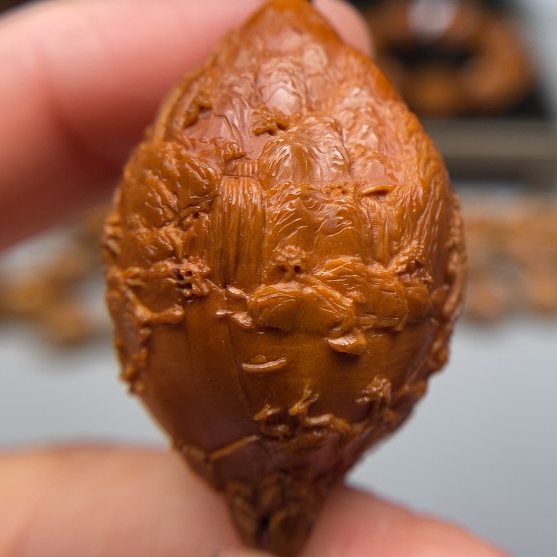 橄榄核吊坠旭日东升