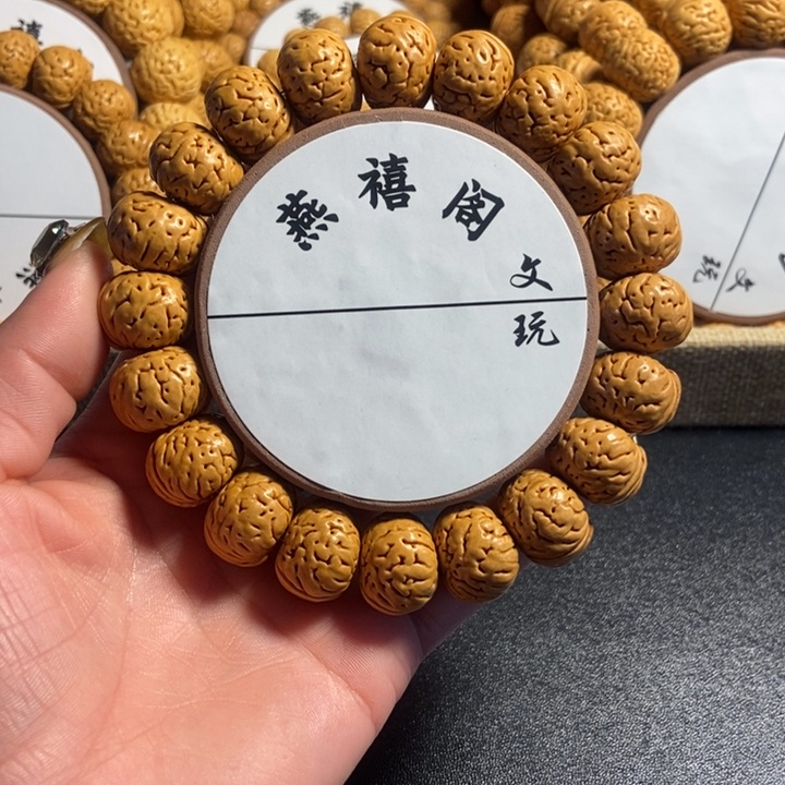 新****发11号，桃核手串纽扣