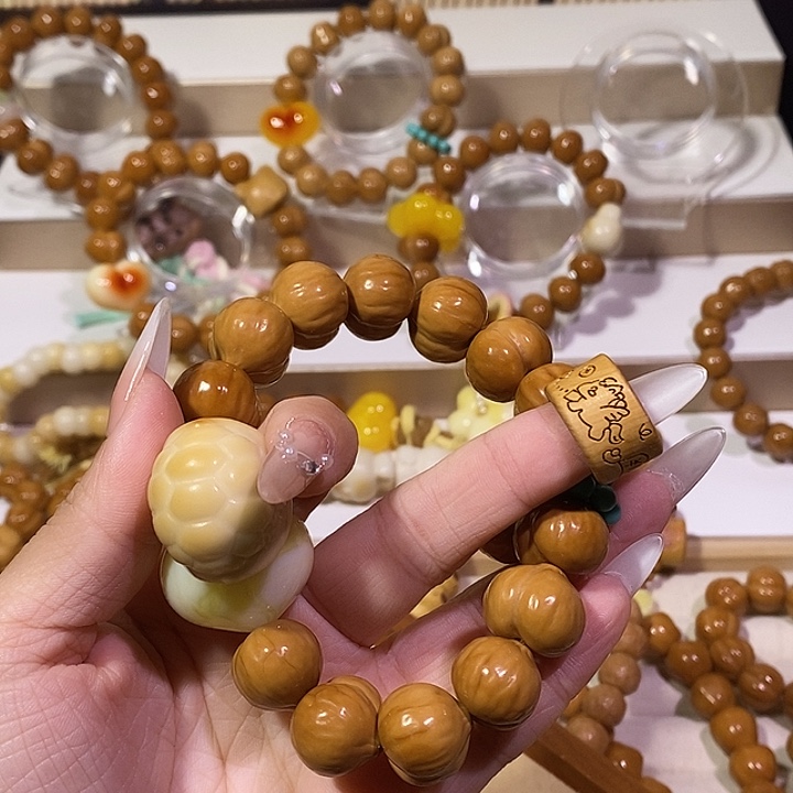 悅***己手串猴头核桃机理屁桃17.3m微方游