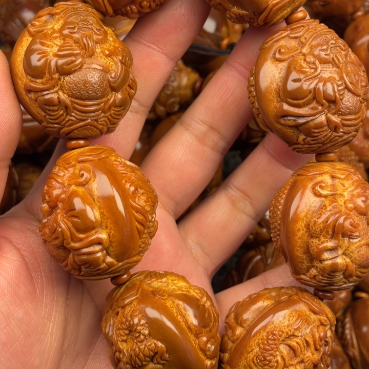 橄榄核吊坠老*啊橄榄核手持