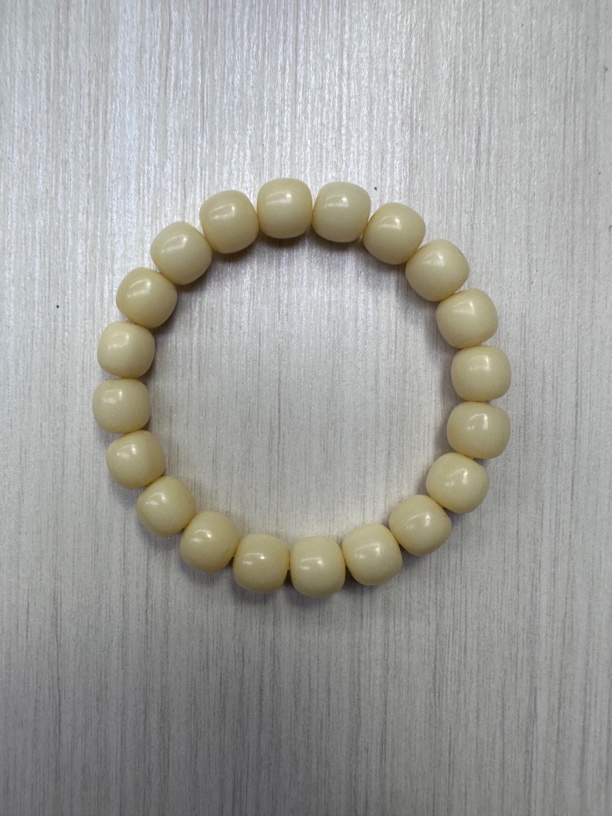 111号骆驼牙1.1桶珠手串