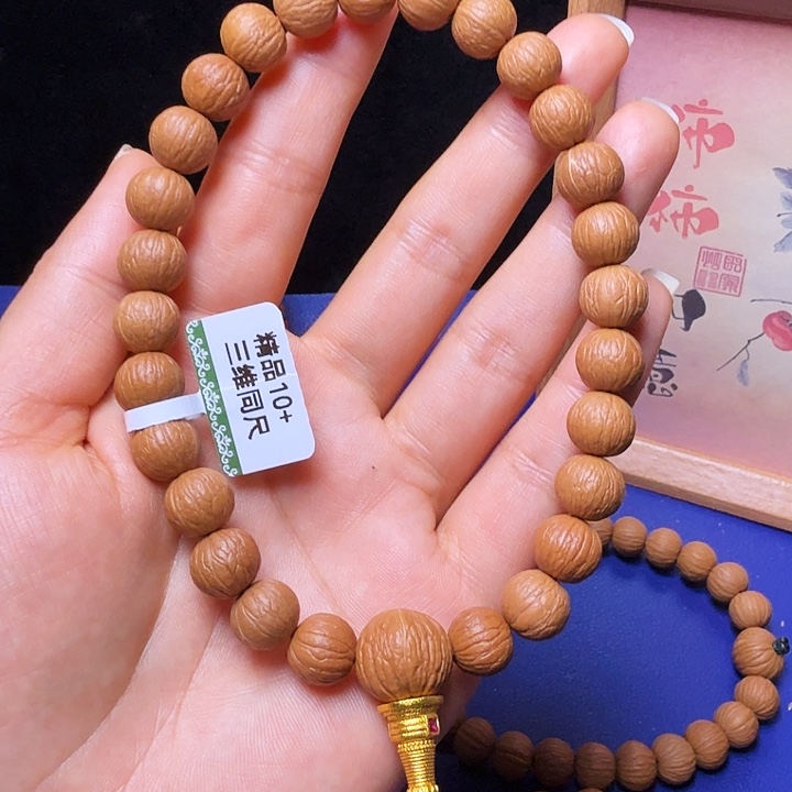 阿***乐吊坠猴头核桃凤羽