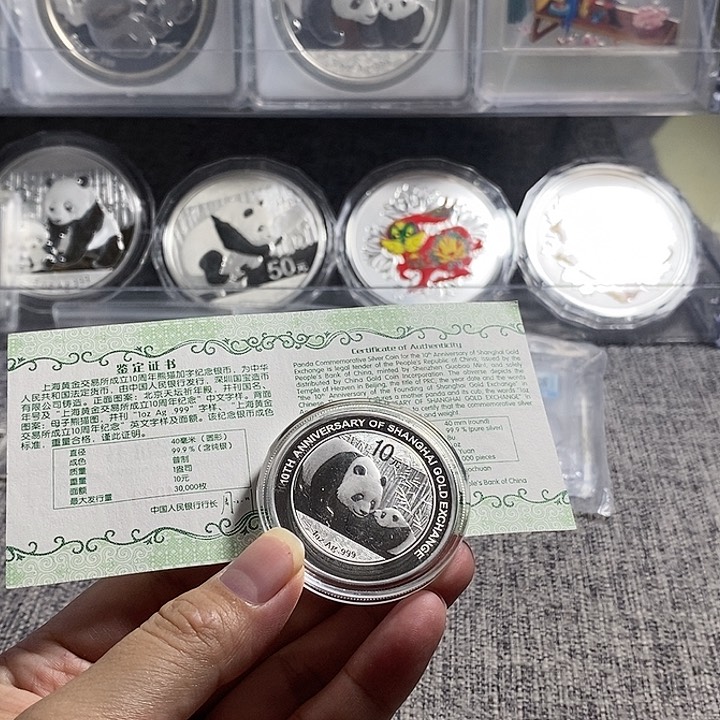纯银2011年金交所加字猫带盒证