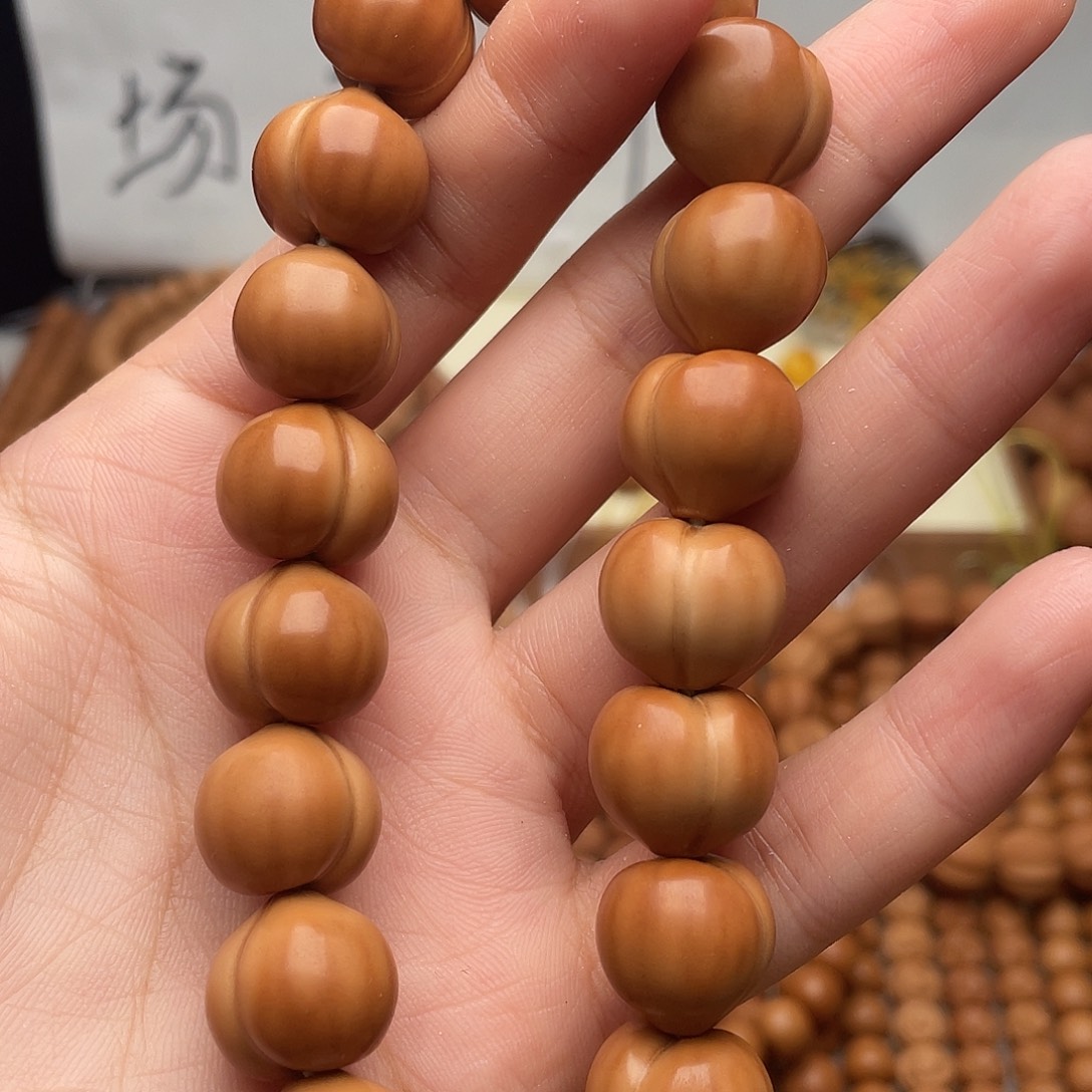 人***欢猴头核桃吊坠屁桃全品