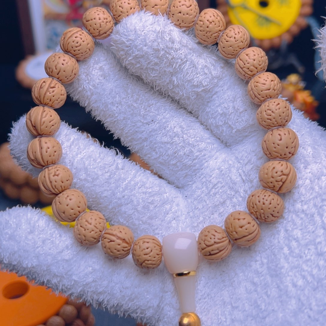 桃核手串1.2奶油变异肥脐