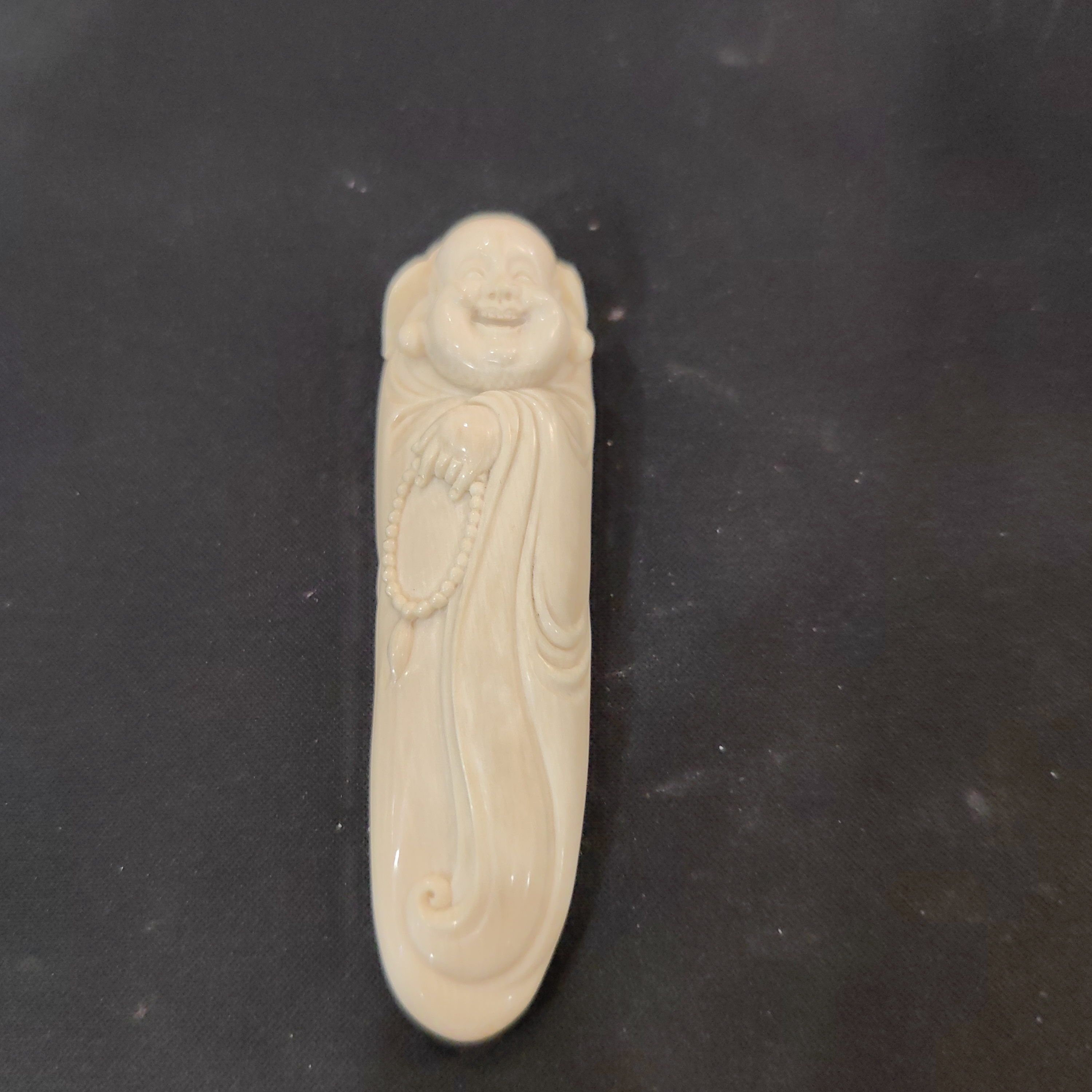 橄榄核雕刻手把件约34.4克K271