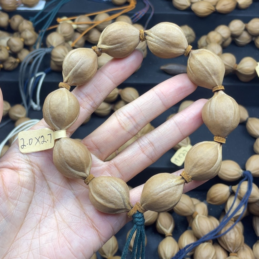 殷***x002橄榄核三花20*27