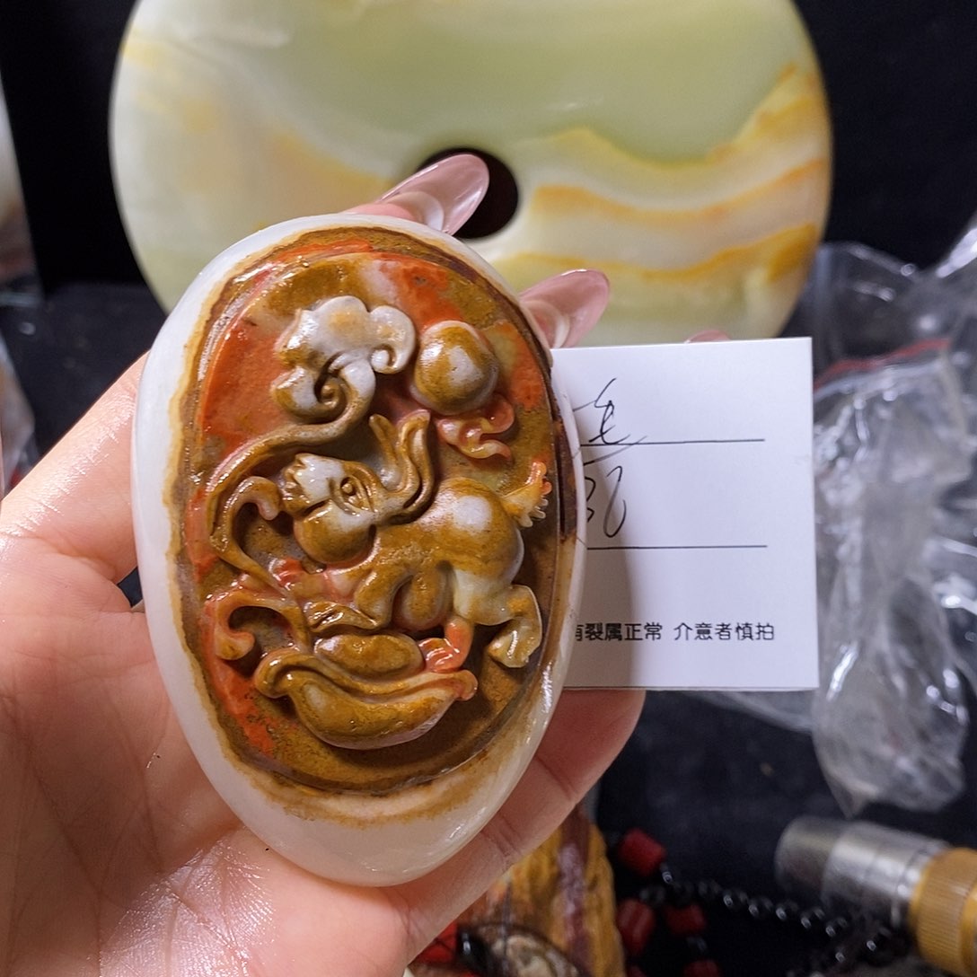 石材一**悔古青石手把件