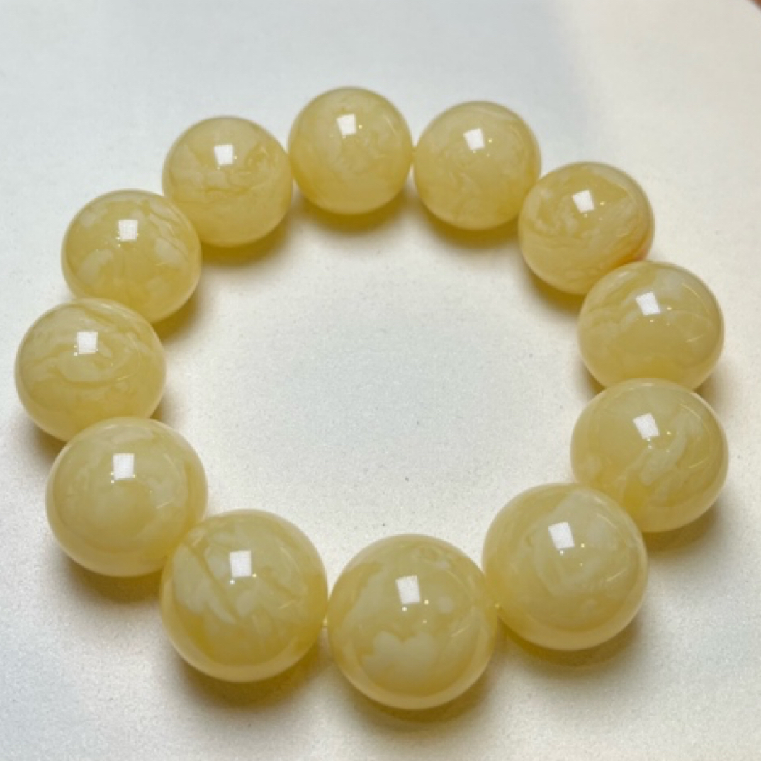 20mm乌料黄白妖花同料串克重54.28克