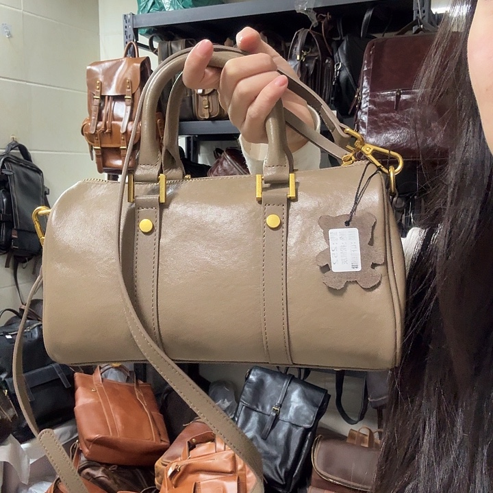 柿***意头层牛皮斜挎包包