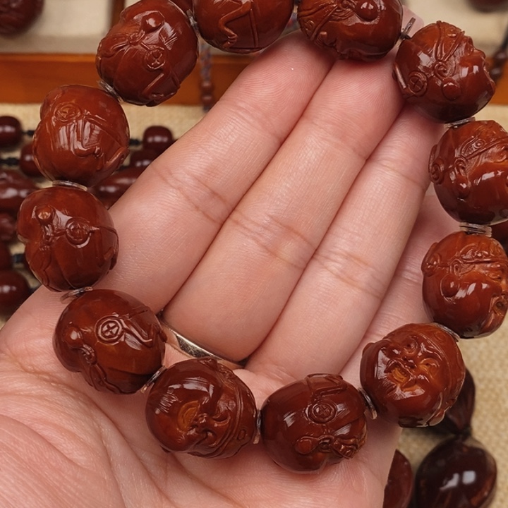 温***司橄榄核吊坠地主老财