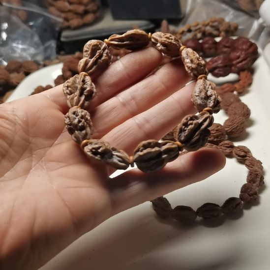 天***云文玩核桃吊坠东北楸异形籽钱袋子23