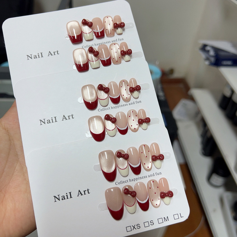 新年红猫眼波点法式蝴蝶结美甲新年款红色氛围感美甲