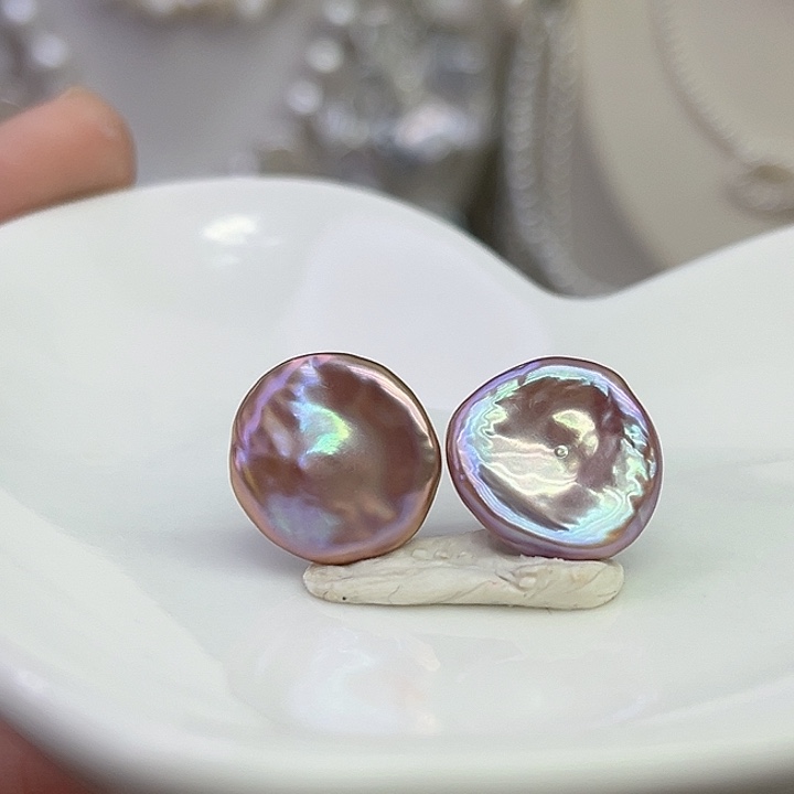 汐****淡水珍珠银S925镶嵌耳饰