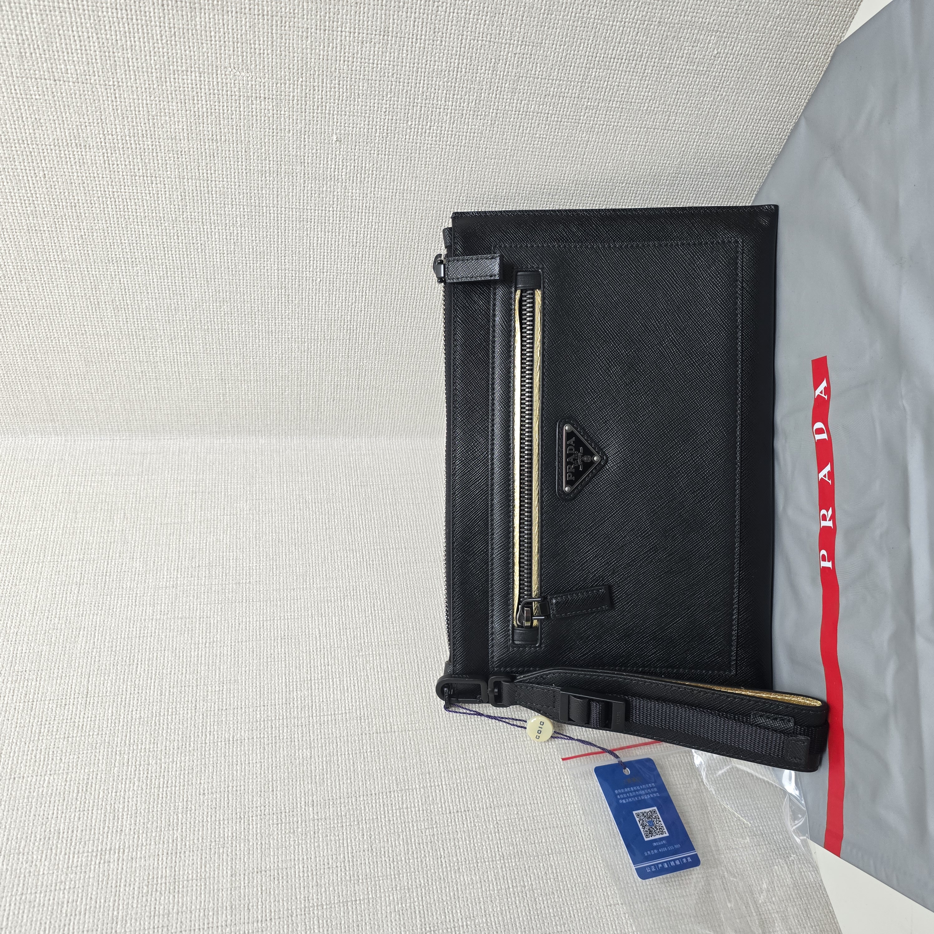 99新 Prada/普拉达 充新成色十字纹手拿包