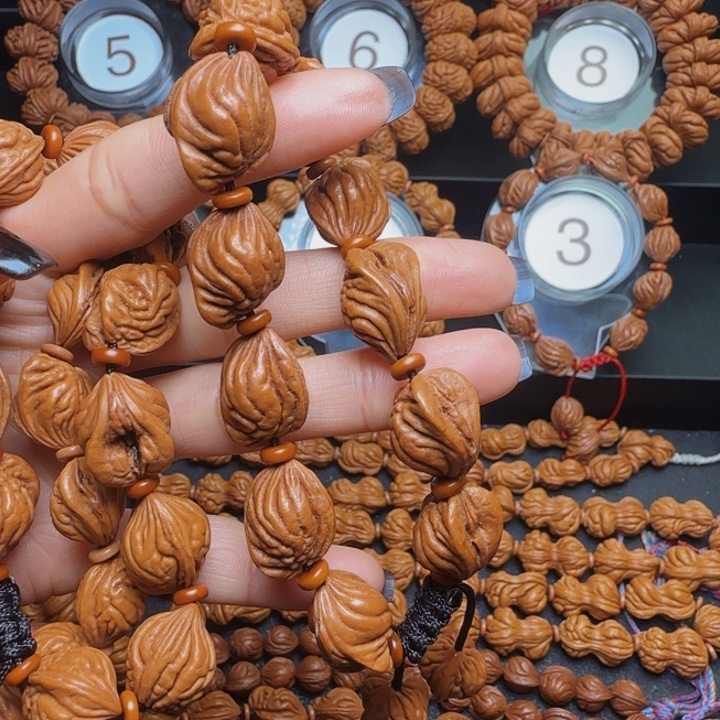 牧***：手串桃核生命手串