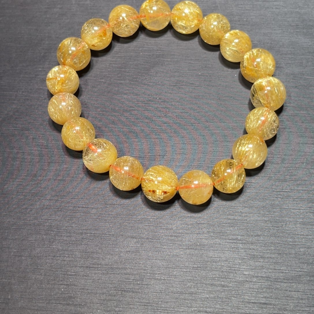 桦***啦未镶嵌水晶手链金钛晶