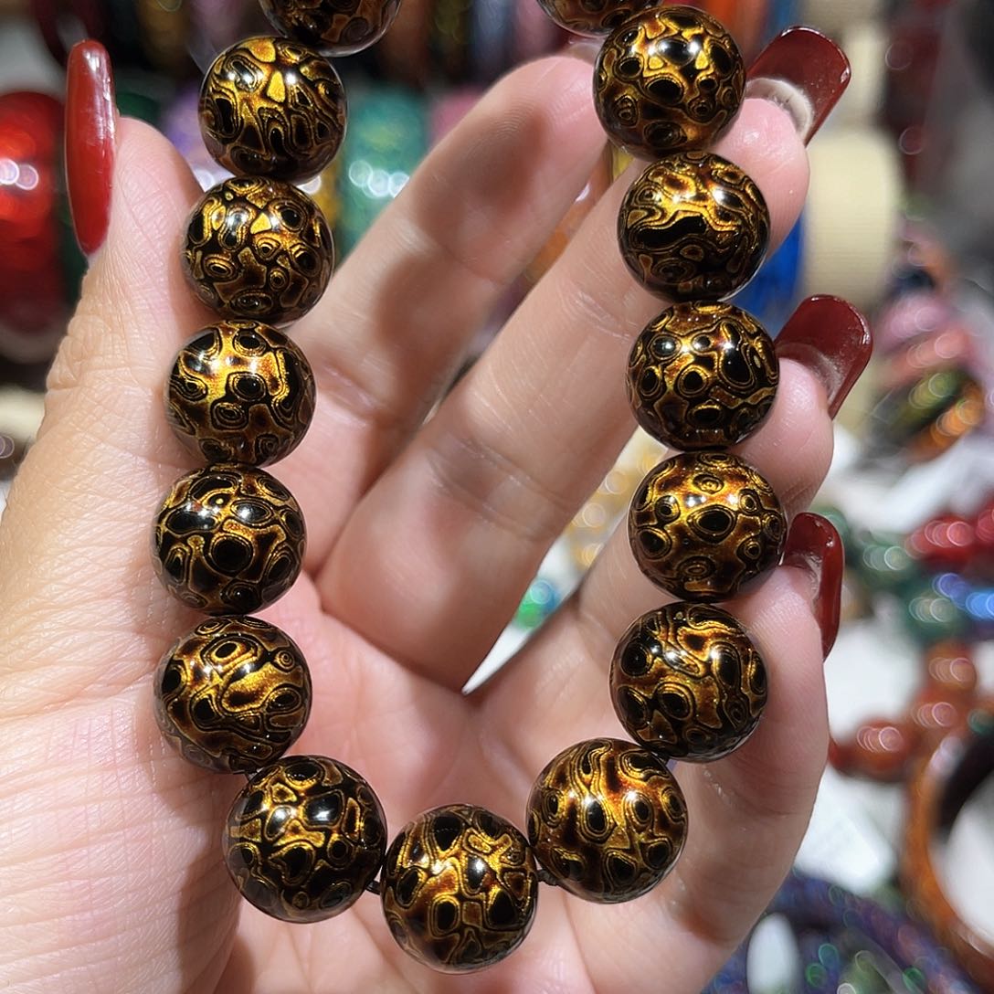 颜*雪大漆珠1.2黑金手串………..