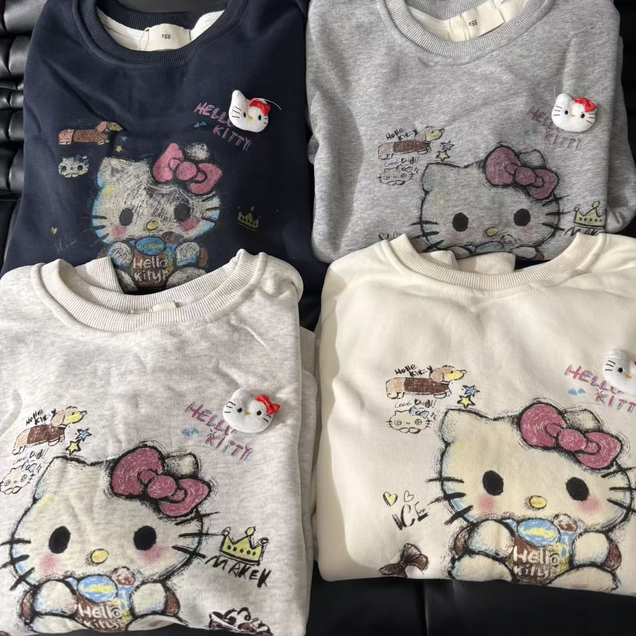 圆领加绒花脸猫卫衣