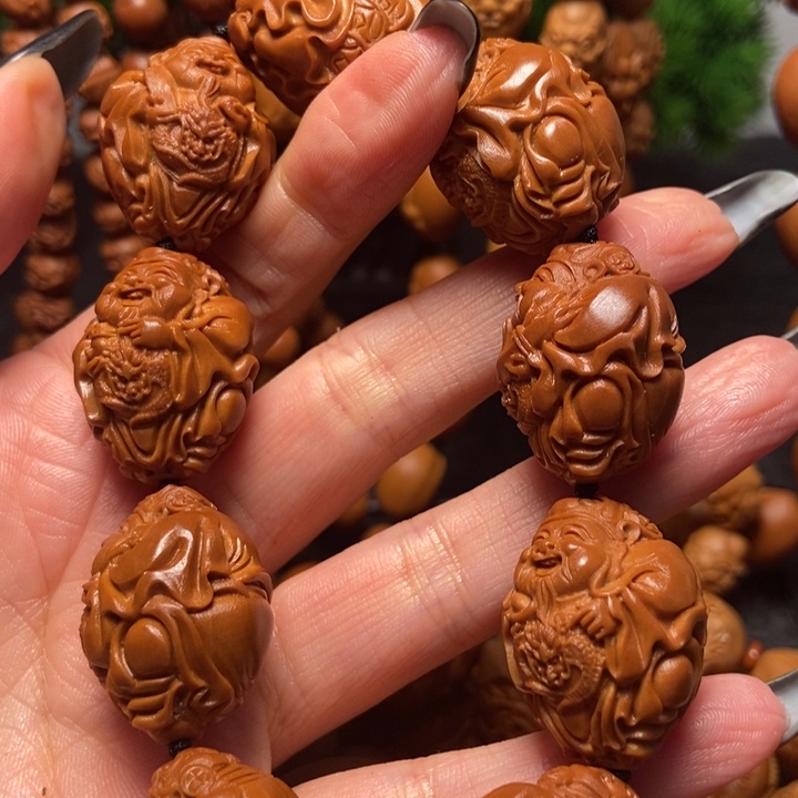 橄榄核吊坠八方来财