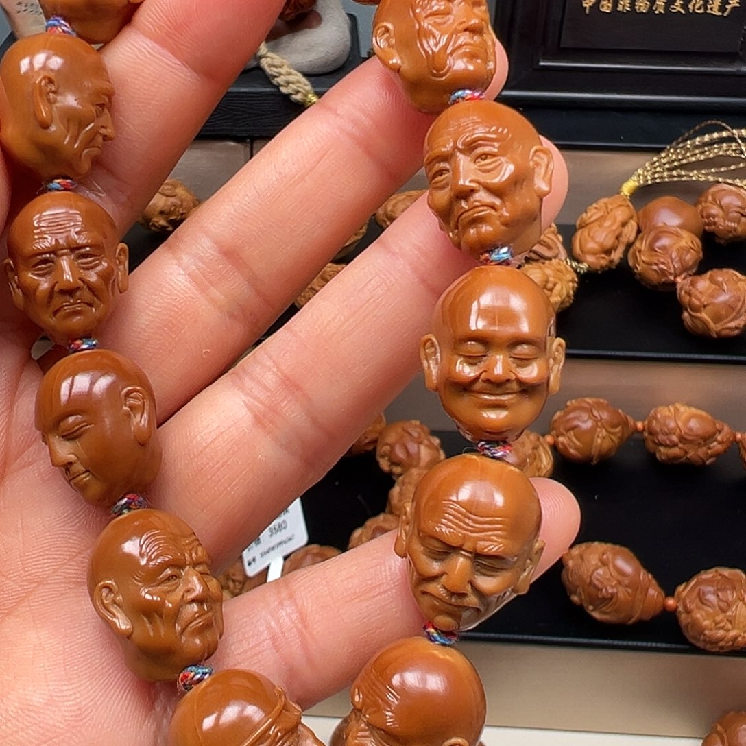 橄榄核吊坠罗汉手串