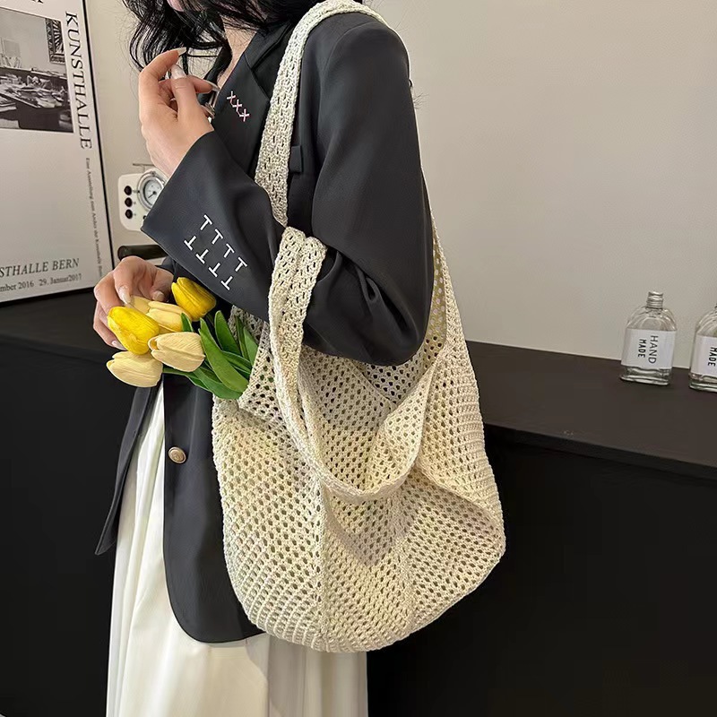 夏季流行新款编织女包手提编织袋时尚洋气单肩网兜包海边旅行草编