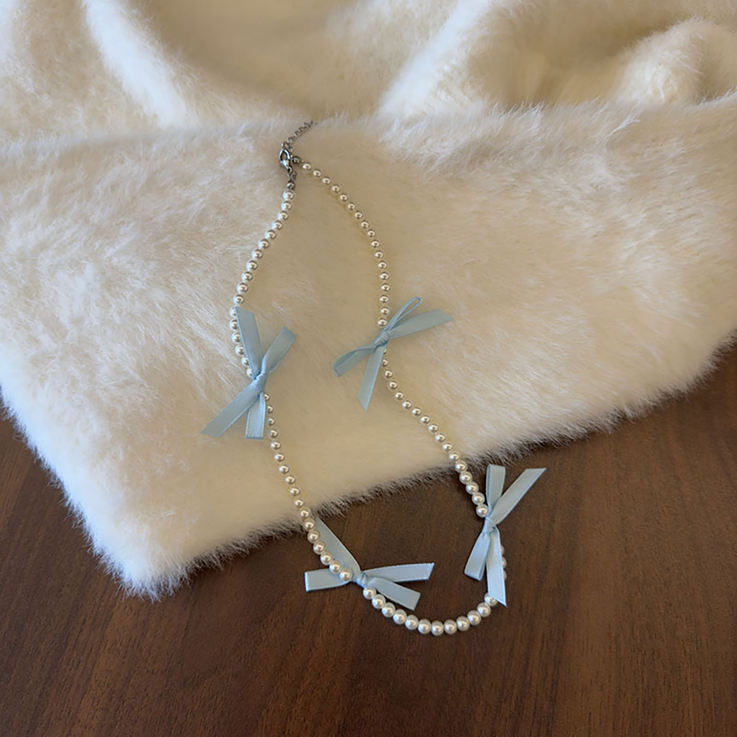 钛钢仿珍珠项链 施家珍珠蝴蝶结锁骨项链日韩少女甜美时尚毛衣链