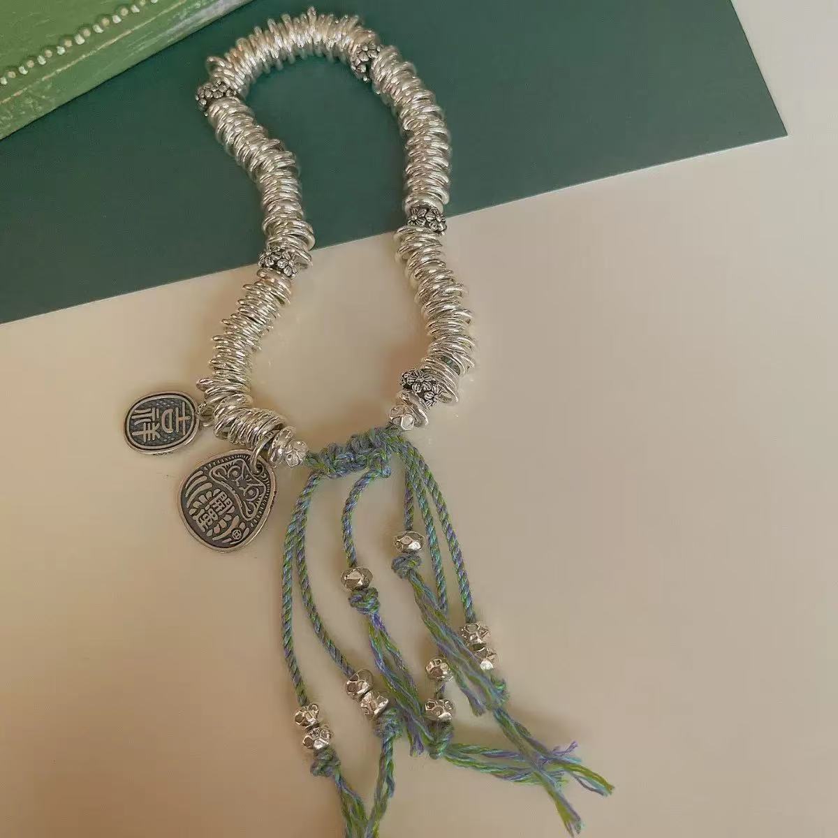 万足银【清货专属链接】货号A912复古绿色盘缠手链