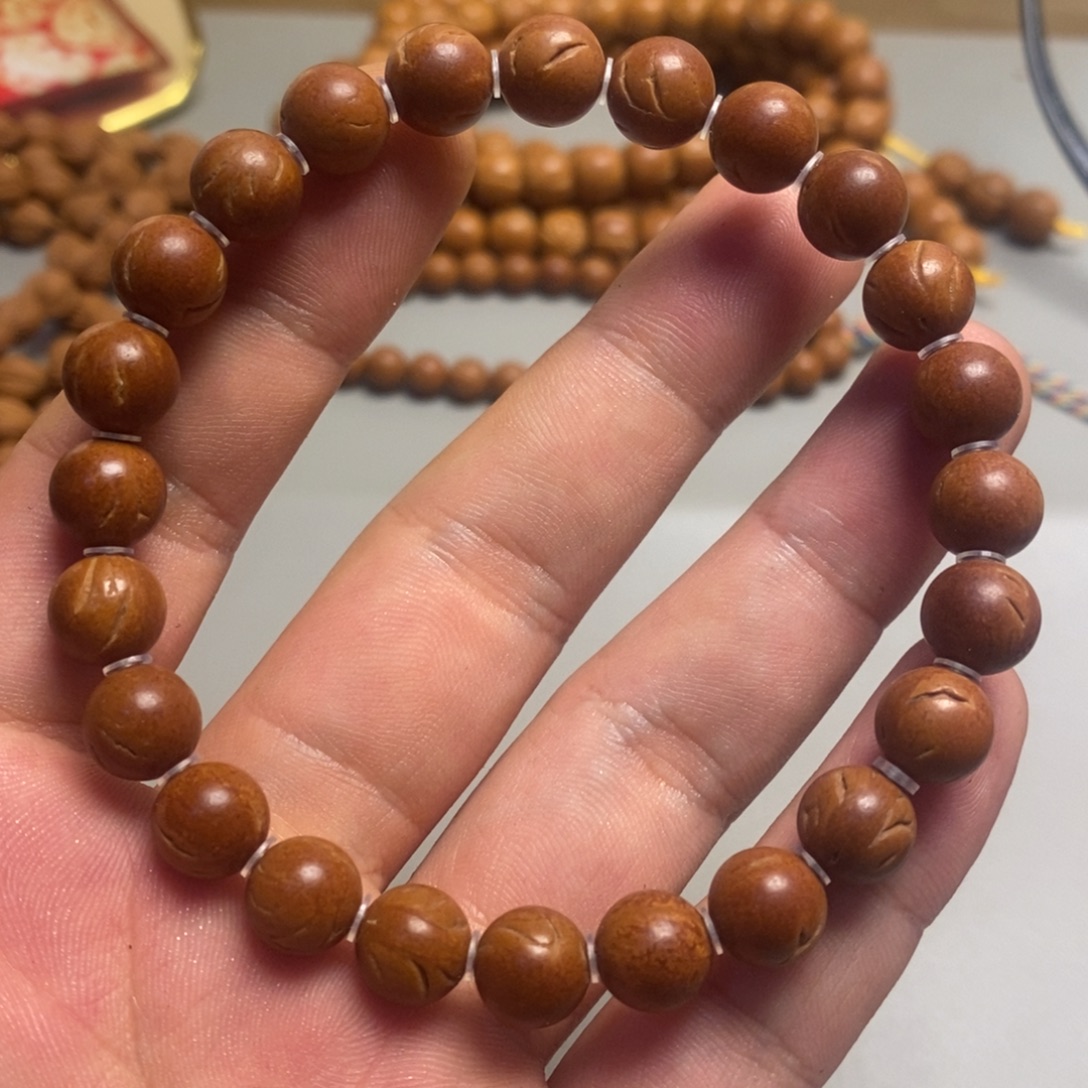 桃核手串龙纹光珠9.5