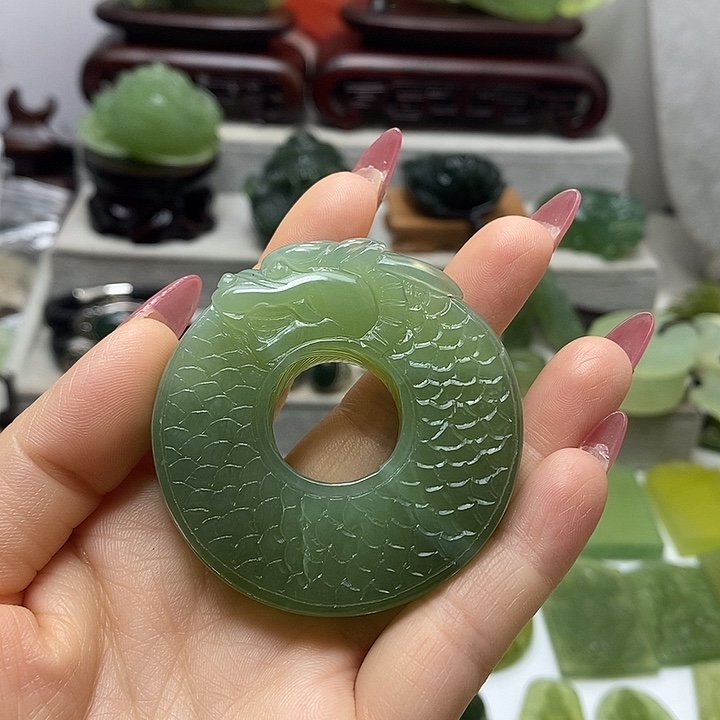 开***对蛇纹石玉未镶嵌手把件