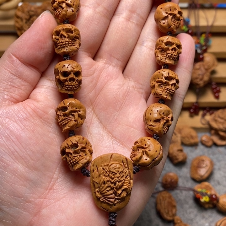 桃核手工雕刻骷髅手持