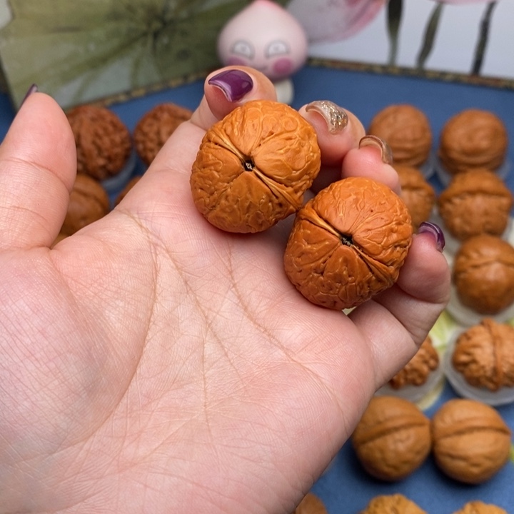 文玩核桃把件两**?蛇皮元宝