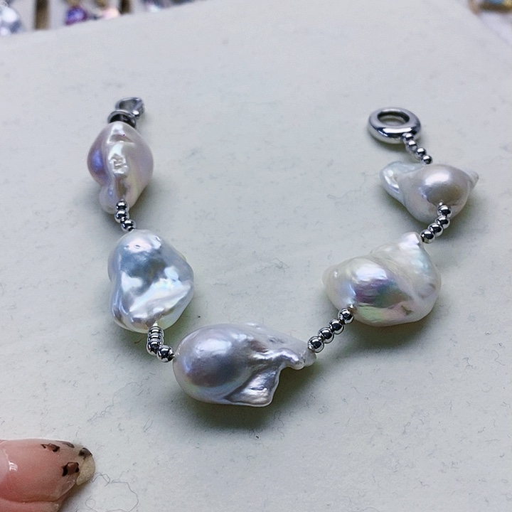 银S925镶嵌耳饰淡水珍珠人**醒