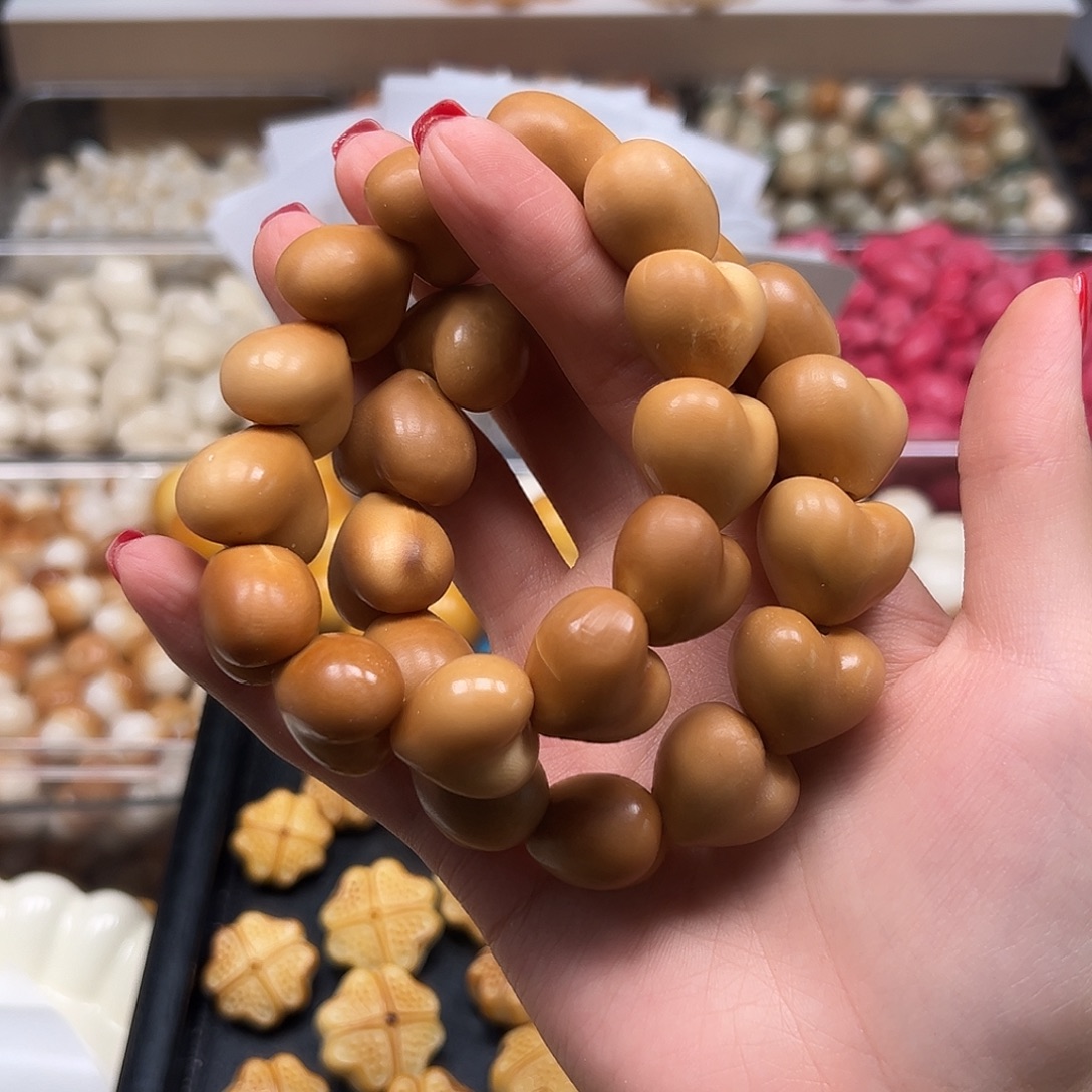 菩提根/象牙果手串瑕疵咖爱心一串