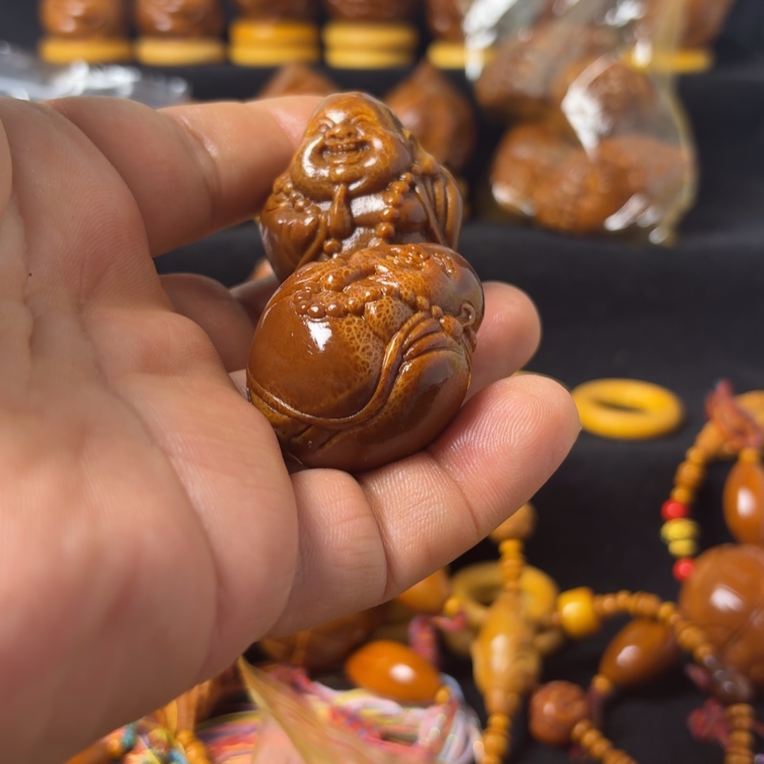 柠***开把件橄榄核小米乐