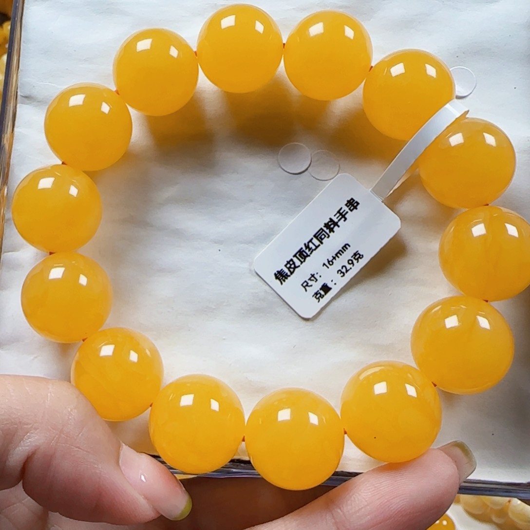 未镶嵌蜜蜡裸石安****蒂16+焦皮橘红同料手串