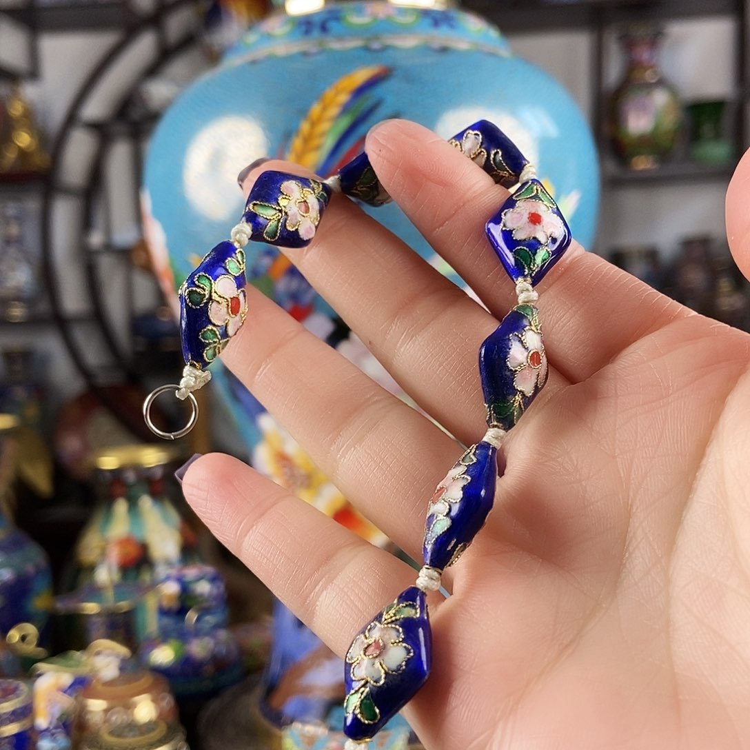 荣***誉铜宝蓝色菱形花丝手链