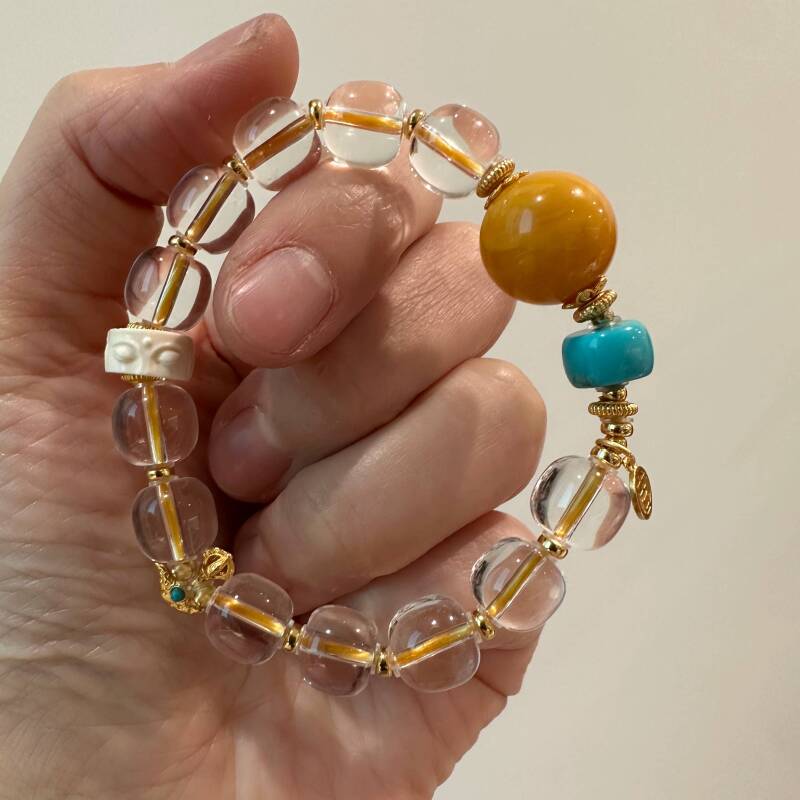 S12443<晶贵坊>白水晶松石蜜蜡佛眼吉字弹力手串S925银