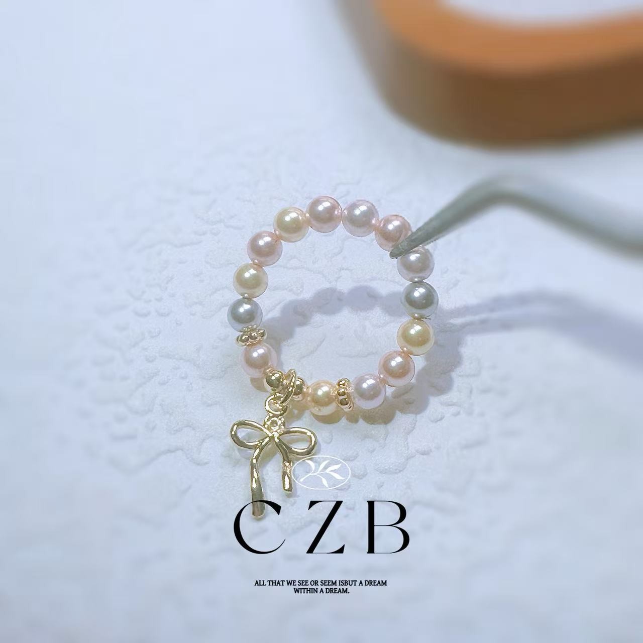 C21彩贝珠蝴蝶结戒圈戒指