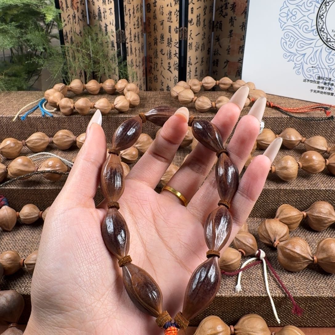 1***4橄榄核吊坠紫皮三花