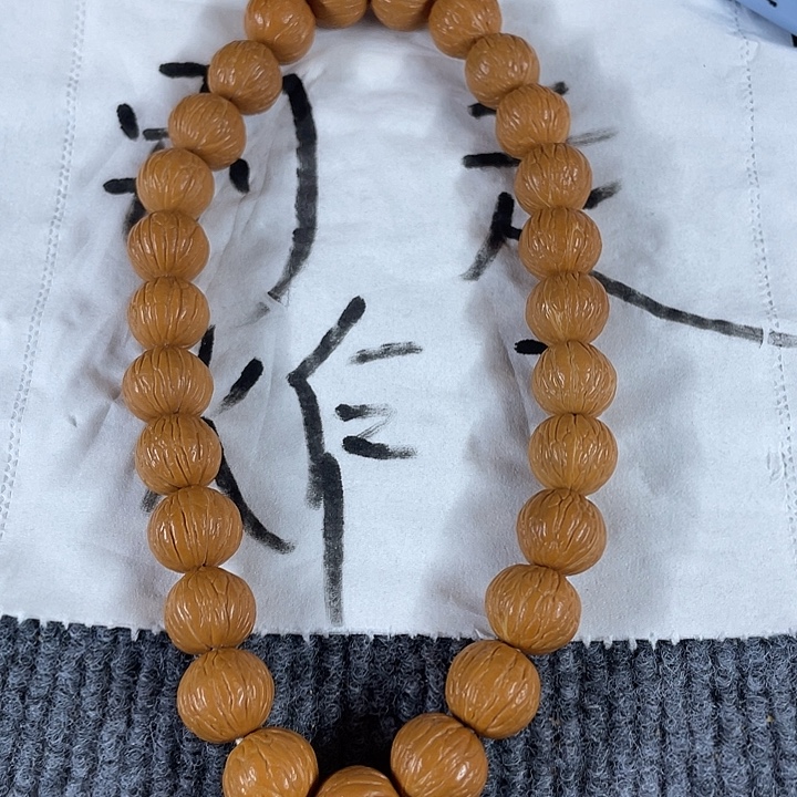 姜***音木质类27颗凤羽猴头手持