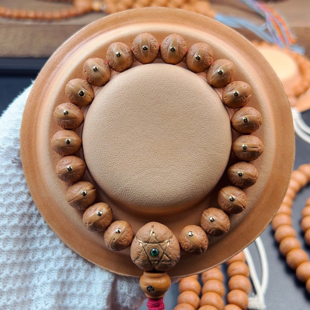 手串凤眼菩提12mm老树籽铜钉飞碟桩