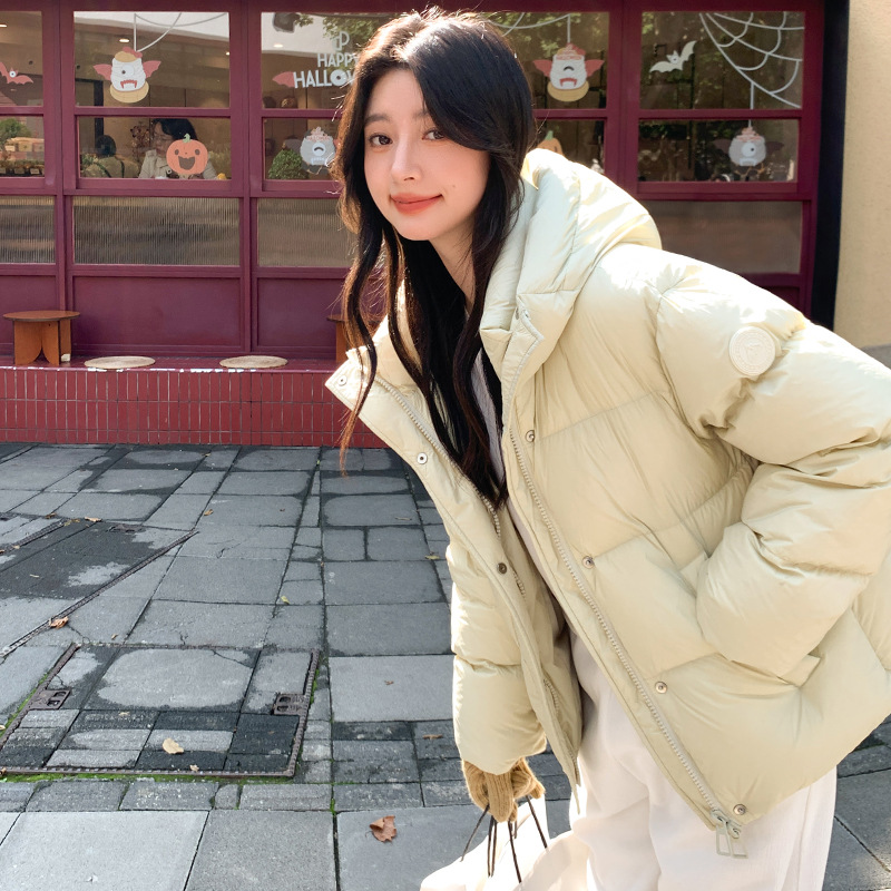 波司登极地联名羽绒服女高级感长短款2025时尚连帽加厚设计感袖标