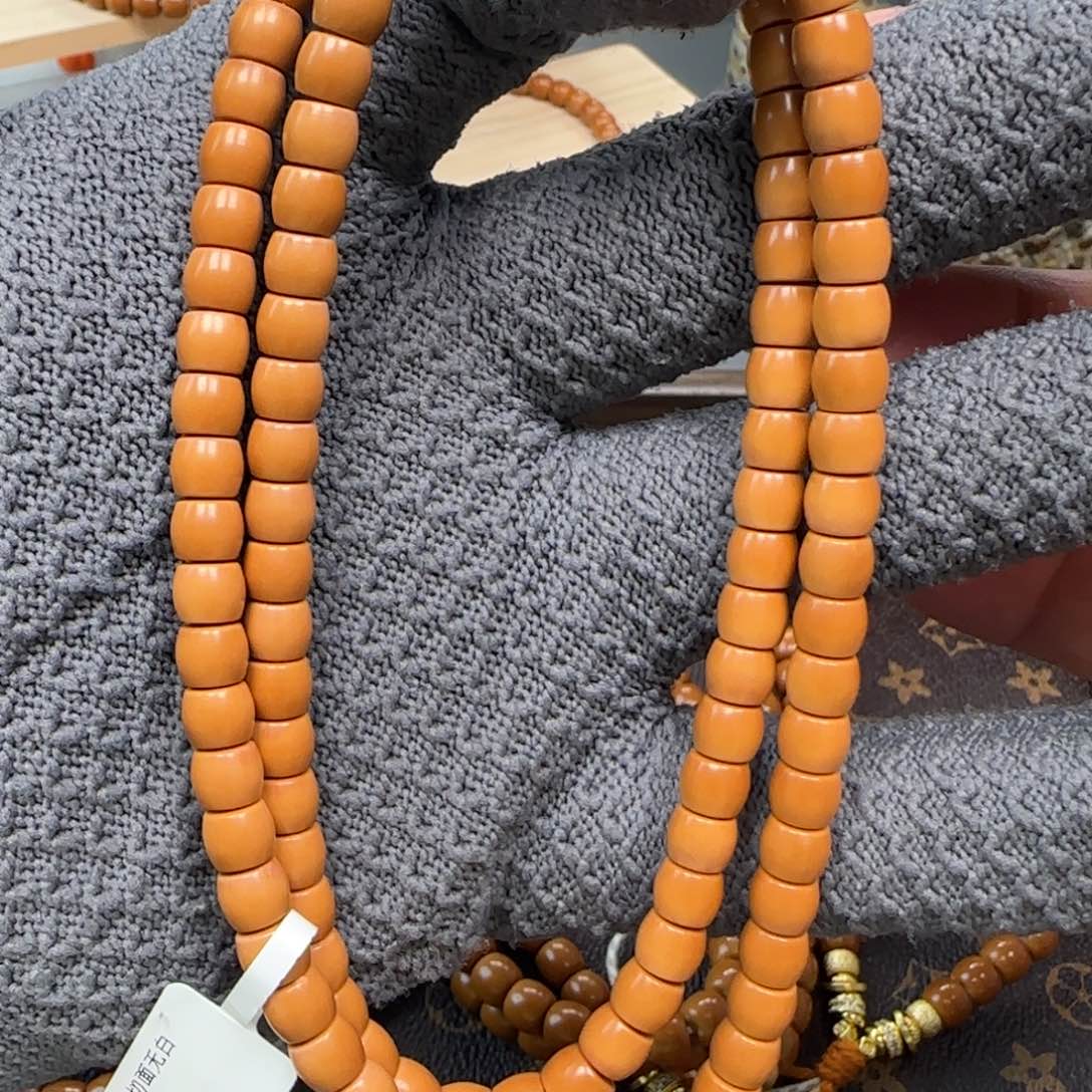 橄榄核吊坠老挝6.6mm直切面无白孔道微瑕