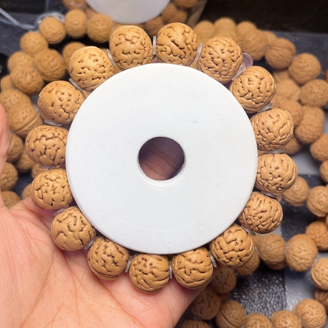 桃核手串达*溜16金豆手串