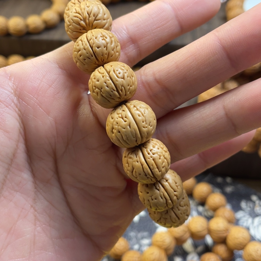 桃核手串王*发肉纹元宝